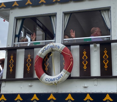 Waving from boat